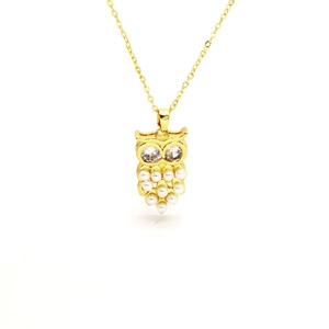 Elegant gold owl pendant necklace featuring white pearls and sparkling zircon stones