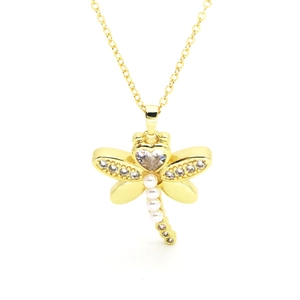 Golden dragonfly necklace with white pearls and sparkling heart crystal on a white background