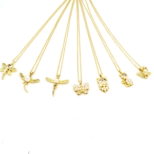 Detailed set of golden dragonfly, butterfly and owl necklaces with pearls and crystals