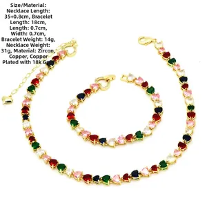 Detail of 18k gold plated jewelry set with colorful heart-shaped cubic zirconia stones