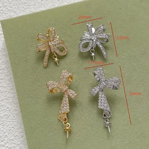 Macro view of gold-plated ribbon bow earring studs with zircon inlay for DIY jewelry