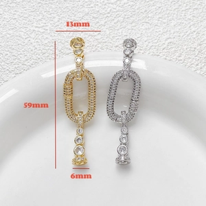 Macro detail of 59mm gold and silver zircon connector clasps for DIY jewelry making