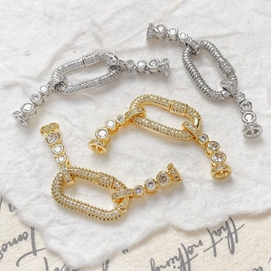 Macro detail of micro-pave cubic zirconia connectors for DIY jewelry in gold and silver