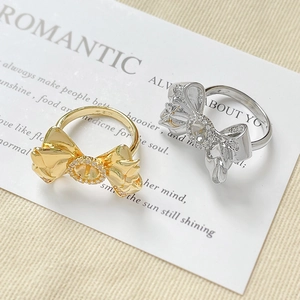 Elegant 18k gold plated bow ring with sparkling zircons in gold and silver finishes
