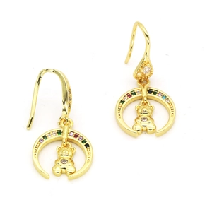 Detail view of crescent moon gold drop earrings with colorful zircon and teddy bear charm