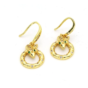 Detail of snake drop earrings in gold finish with white crystals and green stone eyes