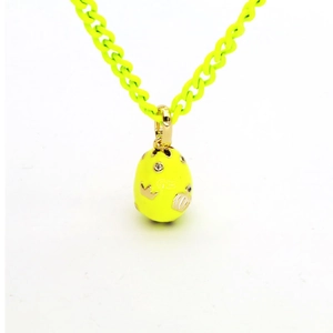 Neon yellow egg pendant necklace with gold crown and crystals on a Cuban link chain