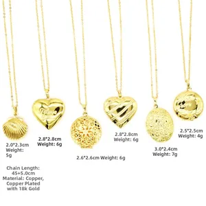 Macro detail of various 18k gold plated lockets including heart and shell shaped pendants