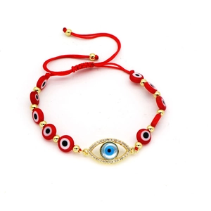 Evil eye red braided cord bracelet with gold charms and sparkling crystal accents