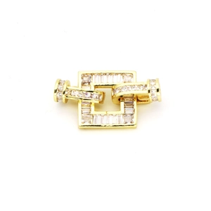 Detailed view of square gold jewelry clasp featuring baguette-cut zircon pavé setting
