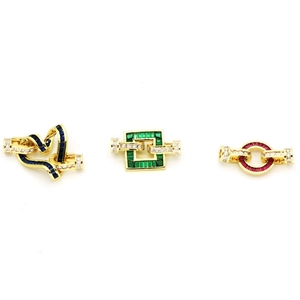 Detail of gold-plated geometric heart and square jewelry clasps with colorful zircon stones
