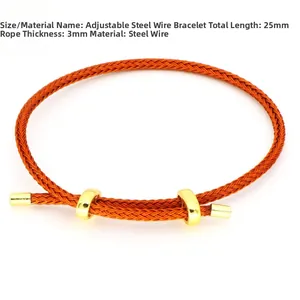 Detailansicht eines 3mm verstellbaren orangefarbenen Stahldraht-Armbands mit Goldakzenten
