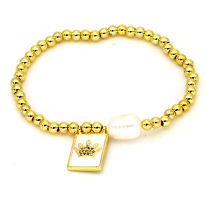 Detail of gold bead bracelet featuring white square crown tag and large baroque pearl