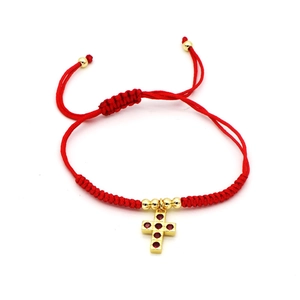 Adjustable red woven bracelet with gold cross pendant and sparkling zircon stone