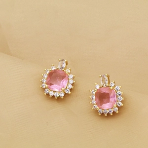 Elegante goldene Schleifenohrringe mit einem rosa Zirkon und funkelndem Diamant-Heiligenschein