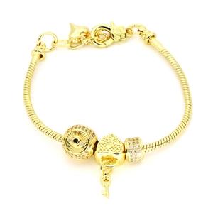 Gold-plated snake chain bracelet with evil eye beads and heart key charm pendants