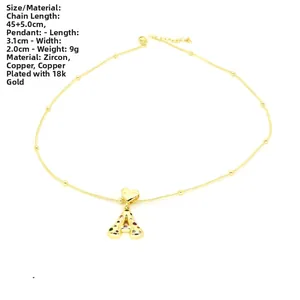 Detail of 18k gold plated copper heart pendant with multicolor zircon letter A charm