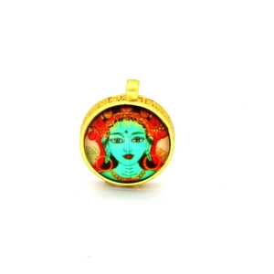 Detailed view of round gold pendant with Green Tara thangka painting and ethnic charm