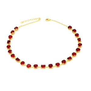 Elegant gold necklace with alternating round and square red emerald cut zircons on white background