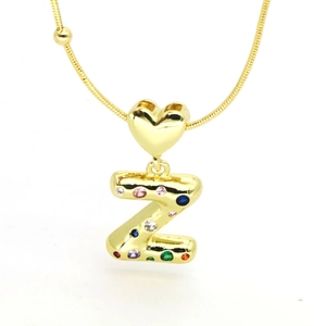 Detail of 18k gold plated heart pendant and colorful zircon bubble letter Z necklace