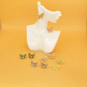 Detailed macro shot of butterfly stud earrings with colorful zirconia in five colors