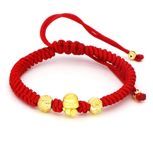 Traditional woven red rope bracelet with golden zodiac lucky charm for the year of snake