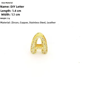 Detail of gold letter A charm with cubic zirconia pavé, sized 1.4cm by 1.1cm