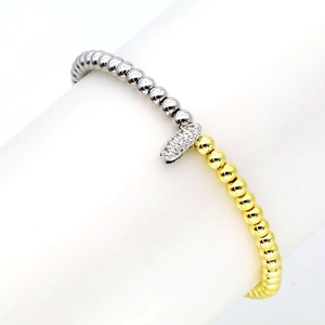 Detail of 18k gold plated beaded elastic bracelet with sparkling zircon pavé rectangular charm