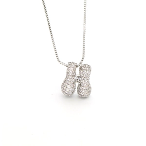 Detailed close-up of a silver-toned H-shaped pendant necklace set with sparkling zircons