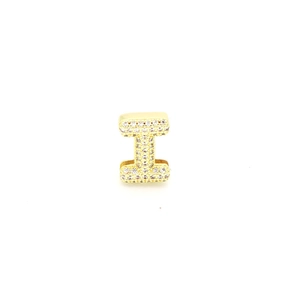 Macro shot of gold-plated letter I pendant featuring sparkling white zircon inlay detail