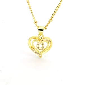Detailed view of golden heart-shaped necklace pendant featuring sparkling letter Q with crystals