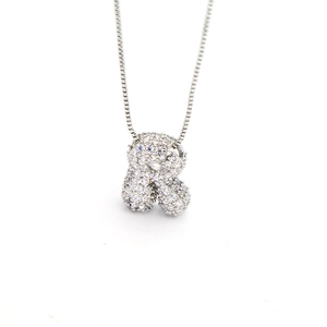 Macro detail of silver bubble letter R pendant necklace with pave-set zircon crystals