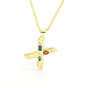 Detailed close-up of a golden cross pendant inlaid with vibrant multi-colored cubic zirconia