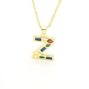 Detailed view of gold letter Z pendant necklace with vibrant multi-colored cubic zirconia