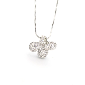 Close-up of silver-tone flower pendant necklace with white cubic zirconia and box chain