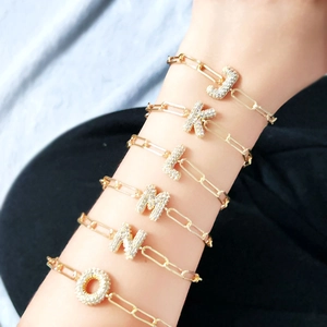 18K gold paperclip chain bracelets featuring zircon-studded bubble letter pendants