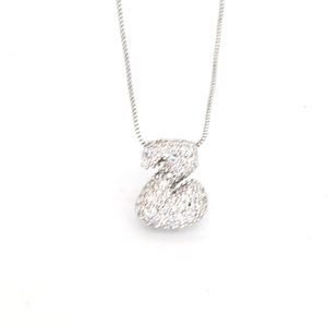 Macro shot of silver Z letter pendant with cubic zirconia on a snake chain