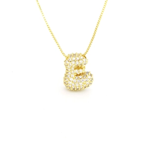 Detailed view of gold-plated letter E pendant featuring sparkling zircon pave setting