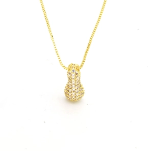 Detailed close-up of a gold-plated puffer gourd pendant with cubic zirconia on a box chain