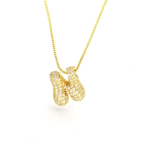 Macro shot of gold-plated bubble letter N pendant with pavé cubic zirconia on box chain