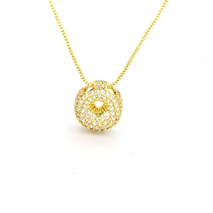 Close-up of golden balloon bubble initial pendant with full pavé cubic zirconia