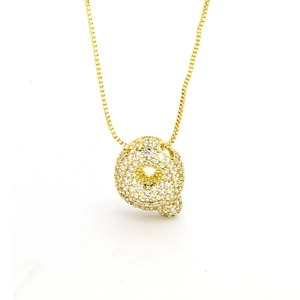 Macro view of gold letter Q balloon pendant with pavé cubic zirconia on box chain