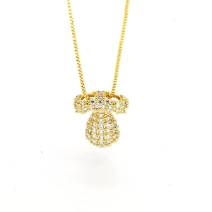 Detailed view of a gold box chain with a mushroom-shaped pendant paved with white zircons