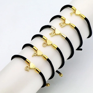 Minimalist copper heart bracelet with micro-paved zircon alphabet charms on black cord