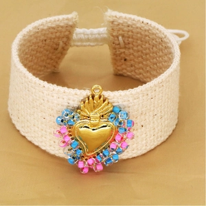 Handmade woven heart bracelet with vintage gold sacred heart charm and colorful beads