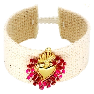 Handmade woven Sacred Heart bracelet with colorful beads and adjustable cream strap