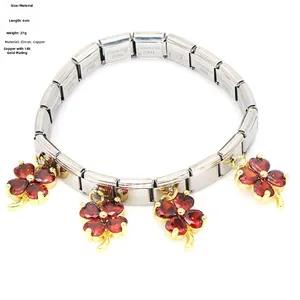 Detail of clover bracelet with red zircon charms and 6cm stainless steel elastic band