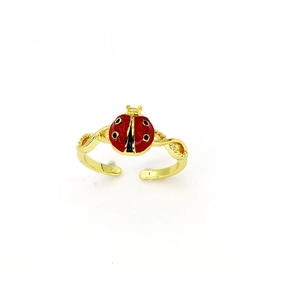Detail of gold ladybug open ring with red enamel and twisted band texture