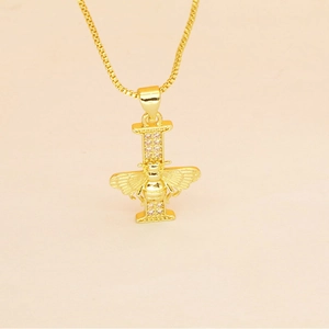 Detailed macro view of gold letter I pendant with crystal accents and bee ornament
