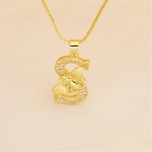 Detailed view of gold plated letter S pendant with iced out stones and a bee charm